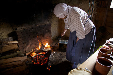 servant tending the fire